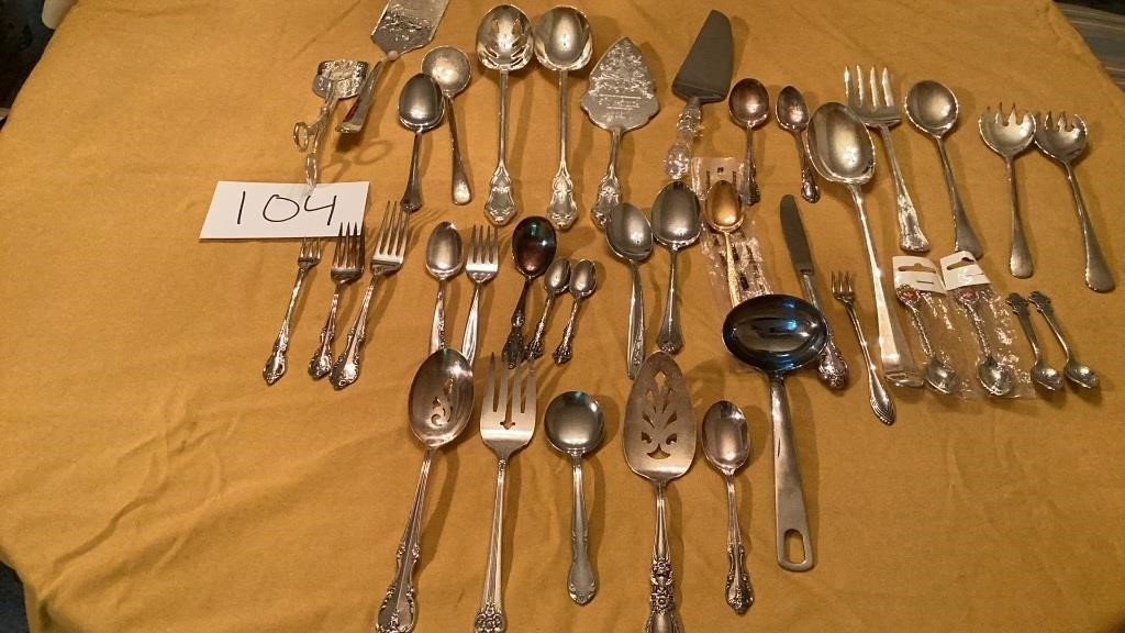 Assortment flatwear, serving spoons, meat forks,