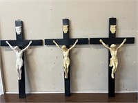 Three Crucifixes on Ebonised Crosses (68 cm H)