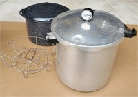 Lot of large metal cookware. Speckled pot.