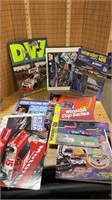 Stack of NASCAR magazines and memorabilia