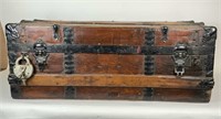 Early metal banded wood trunk