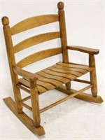 Unusually wide child's rocking chair