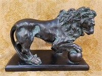 LION W PAW ON BALL SCULPTURE