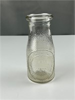 Heritage Dairy embossed milk bottle