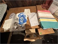 tote of table cloths and foam cushion