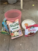 plant fertilizer and bird seed in bucket