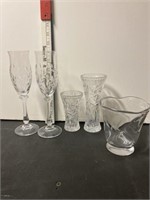 2 champagne glasses and 3 vases