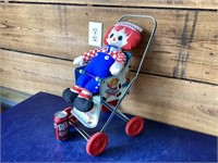 Raggedy ann doll and stroller