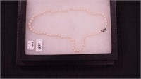 18" strand of pearls, clasp marked 925