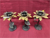 3 metal art lawn candle holders.