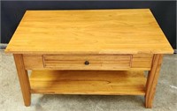 Wooden coffee table with drawer