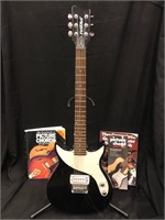 First Act Guitar with amp, cord and 3 guitar books