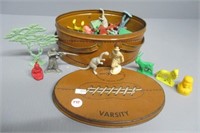 Vintage Varsity tin box with children's toys.
