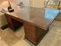 Large executive desk with glass top and chair