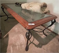 Glass top coffee table with iron legs 28x49