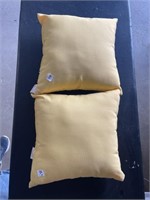 2 yellow cushion pillows