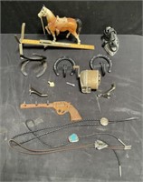 Group of horseshoe hangers, bolo ties etc