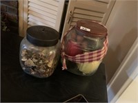TWO GLASS JARS. ONE WITH ARTIFICIAL FRUITS