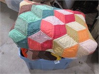 assorted quilts and blankets