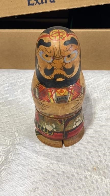 Hand painted wooden piece of nesting  doll