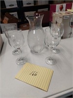 Glass pitcher and stemmed goblets