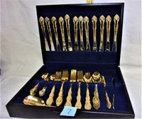 service for 12 gold tone flatware in box