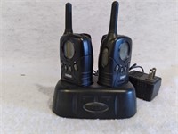 F7)  2 walkie-talkies with plug in charger.