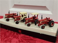 4 small display tractors no lid for box