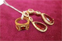 3pc Ring w/ red stone, pair of earrings w/ red