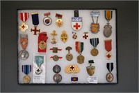 ~80 medals/pins, mostly Red Cross. Europe, US, etc