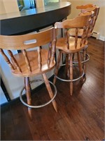 4 wooden bar stools with metal foot rest