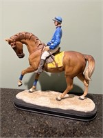 Horse and jockey statue