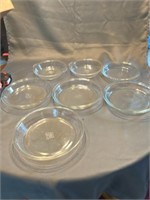 seven Pyrex glass dishes