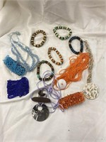 Bag of miscellaneous beaded jewelry bracelets and