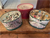 Three sewing boxes with sewing related material