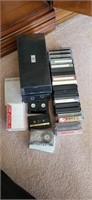 Group of cassette tapes plus containers