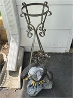 Concrete eagle beak is broke and plant stand