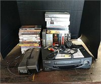 Assortment of DVDs, VHS tapes, VHS rewinder,