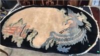 Antique Asian hand-knotted rug.