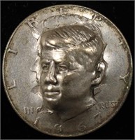 1967 KENNEDY HALF DOLLAR FACE PRESSED OUT