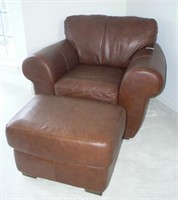 Overstuffed brown leather chair and ottoman