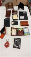 Assorted leather wallets, money clips, glasses
