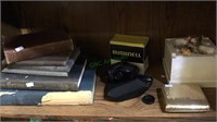 Shelf lot with old books, Bushnell binoculars,