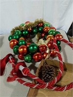 Christmas ornament wreath, and red rope