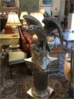 Silvered metal eagle on matching column pedestal