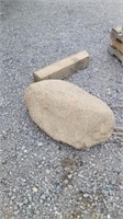Large oval rock take 3 people to lift