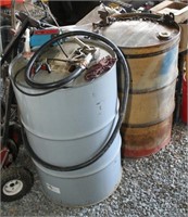 (2) steel 55 gallon drums - 1 having a Chicago
