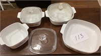 4 Corningware bowls. 2 with lids, 1spare lid