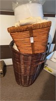 Two wooden laundry baskets filled with