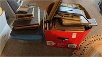 Two boxes of all sized picture frames